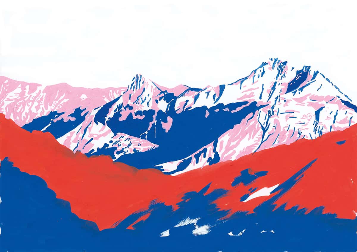 Montagnes enneigées avec sommets pointus et vallées colorées.